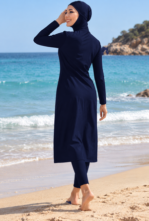 Back view of women's navy full-coverage modest swimwear with hijab, long tunic and leggings