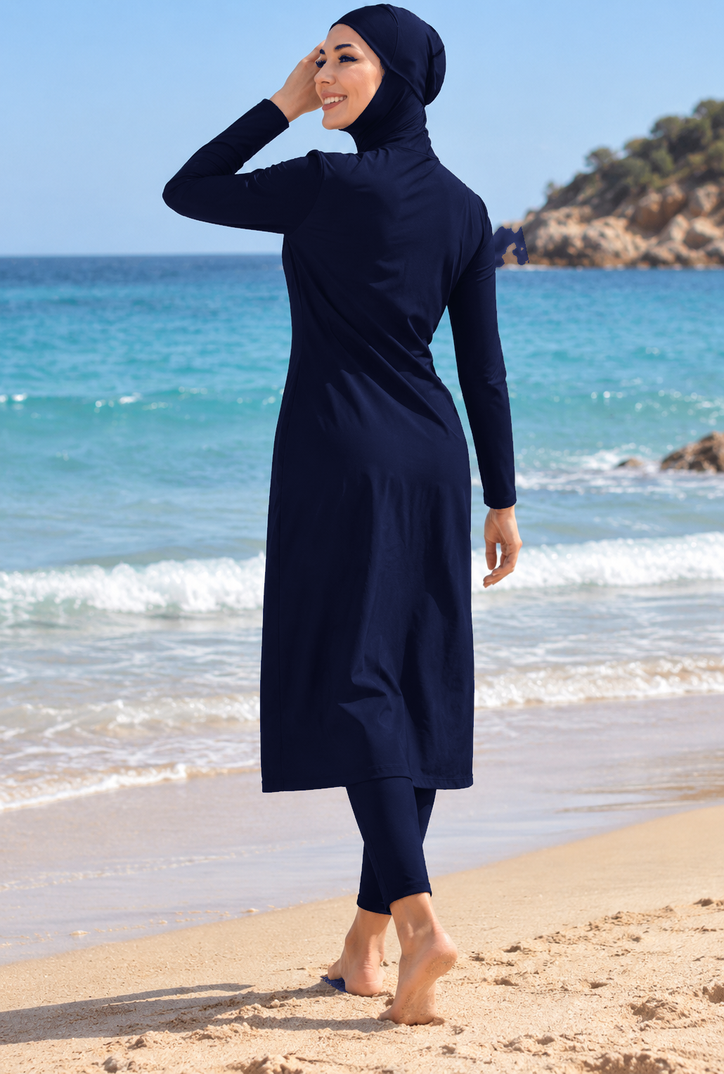 Back view of women's navy full-coverage modest swimwear with hijab, long tunic and leggings